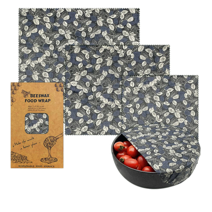 Set of beeswax food wraps with a pattern and a box labeled 'Beeswax Food Wrap' on a white background.