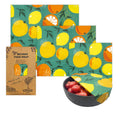 Set of beeswax food wraps with fruit pattern on a white background

