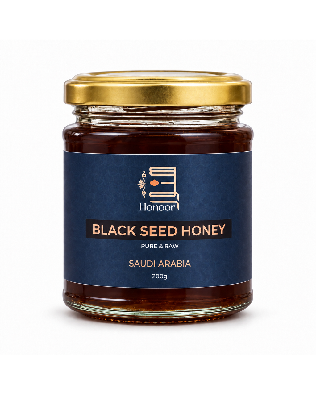 A glass jar of Honoor Black Seed Honey with a gold metal lid and a dark blue label, set against a plain white background.

