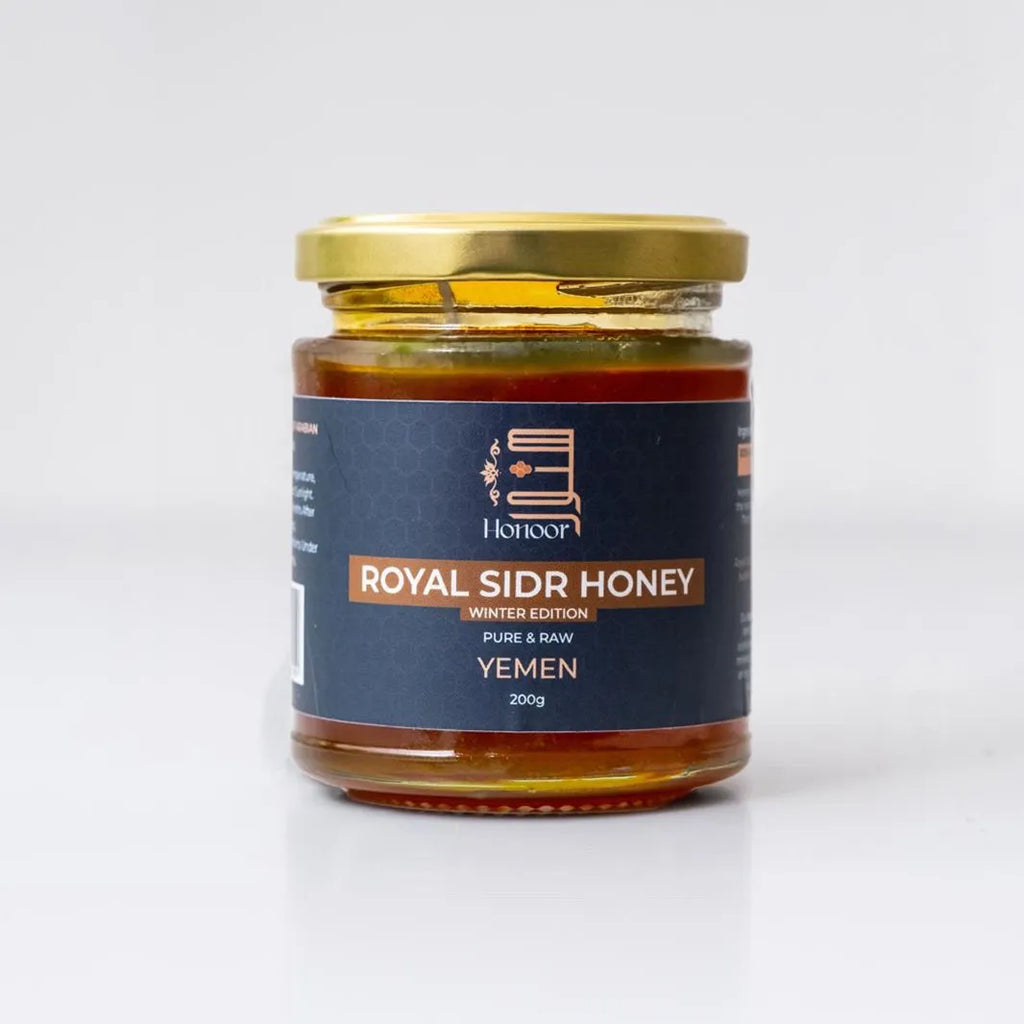 Jar of Royal Sidr Honey with a gold lid on a white background

