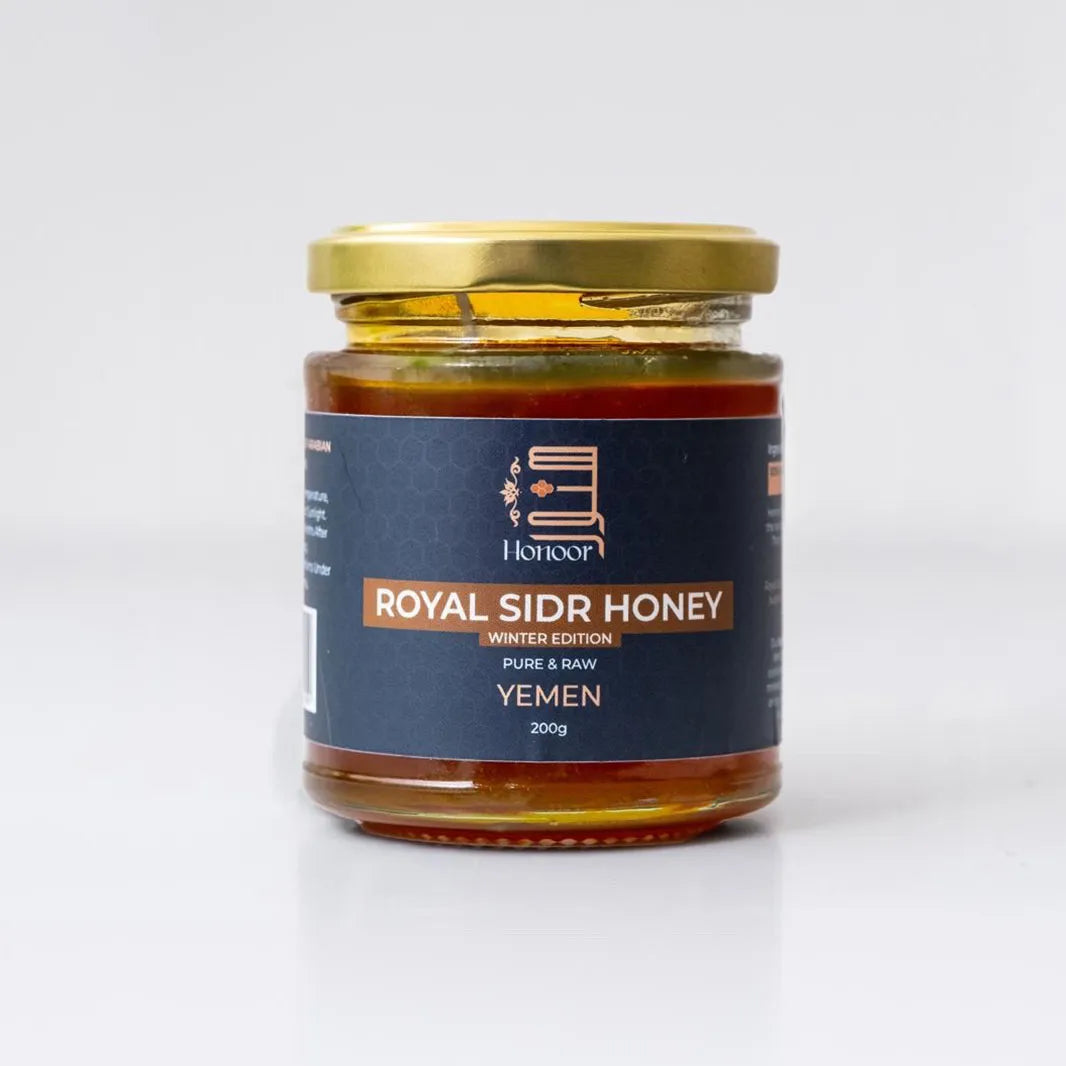 Jar of Royal Sidr Honey with a gold lid on a white background

