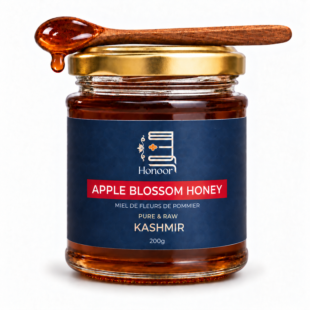 A glass jar of Sidr Honey from the brand Honoor, featuring a dark blue label and a gold metal lid. A wooden spoon filled with dripping amber honey rests on top of the jar against a clean white background.

