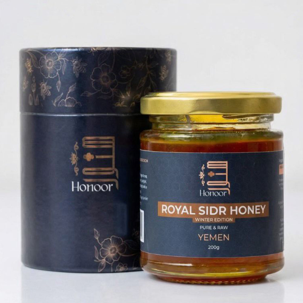 Jar of Royal Sidr Honey with decorative packaging on a white background

