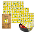 Beeswax food wrap with lemon pattern and packaging on a white background

