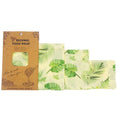 Beeswax food wrap with leaf pattern and packaging on a white background

