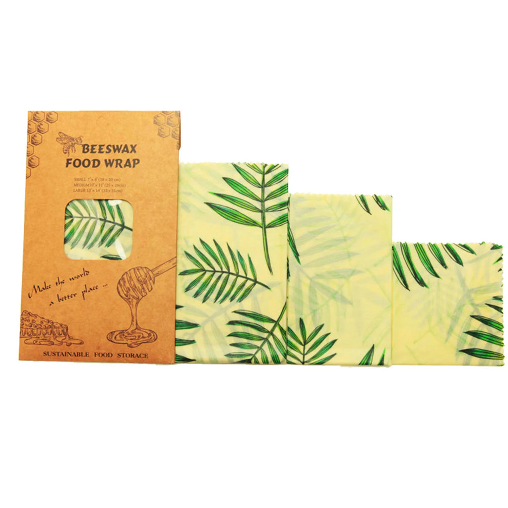 Beeswax food wrap with leaf pattern and packaging on a white background

